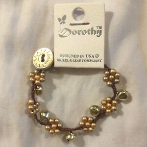 DOROTHY Braided Flower Beaded Charm Bracelet Gold-toned bells & Sundial Closure